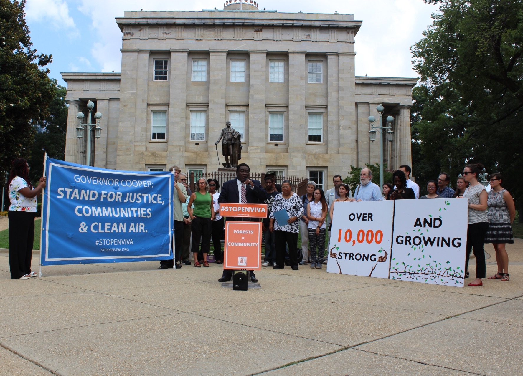 a group of activists rallying around the state capitol