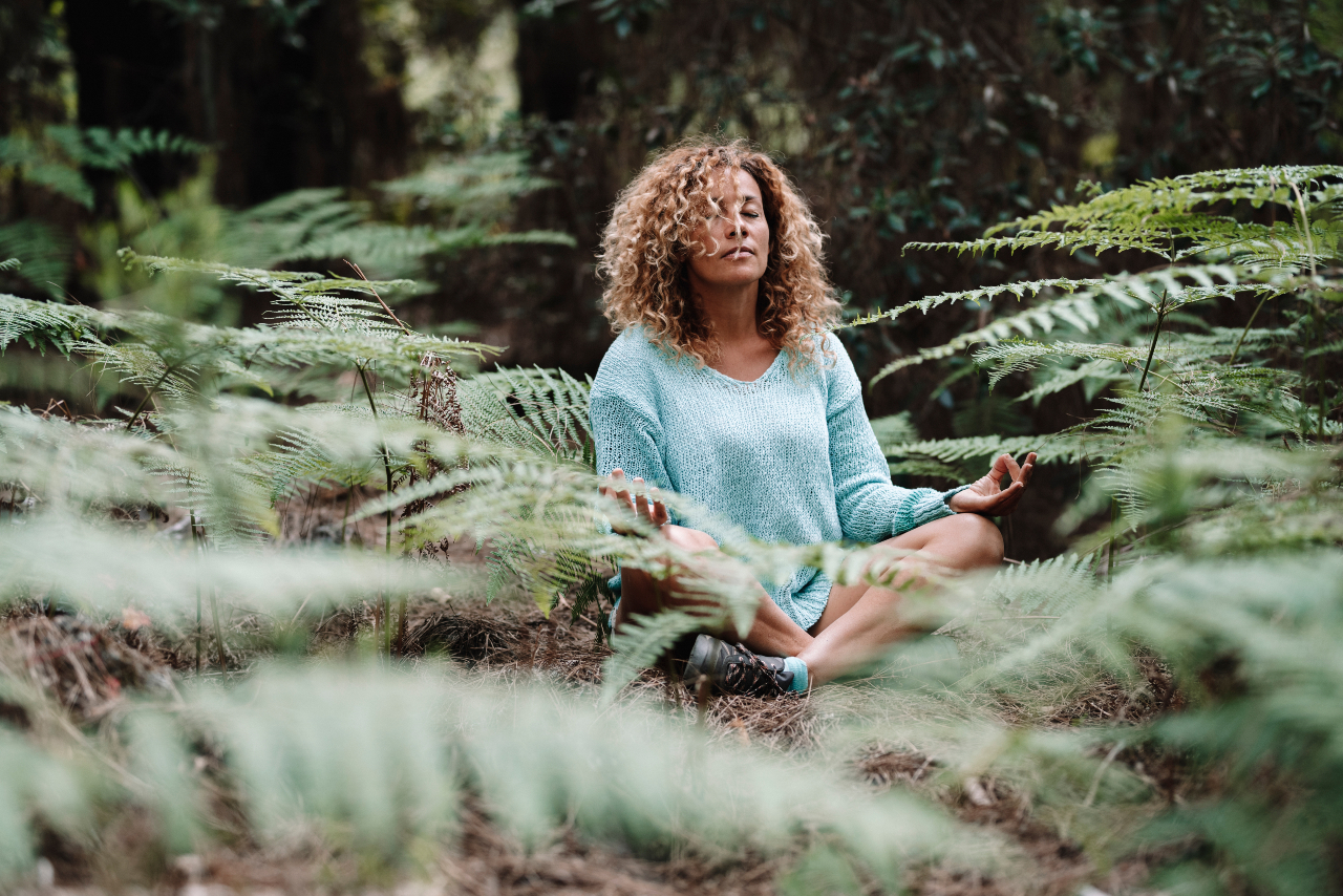 black-woman-meditating-in-the-forest
