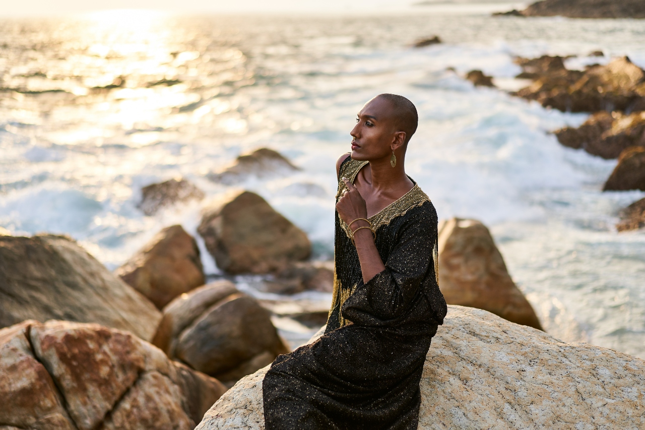 lgbt-black-person-on-rocky-beach