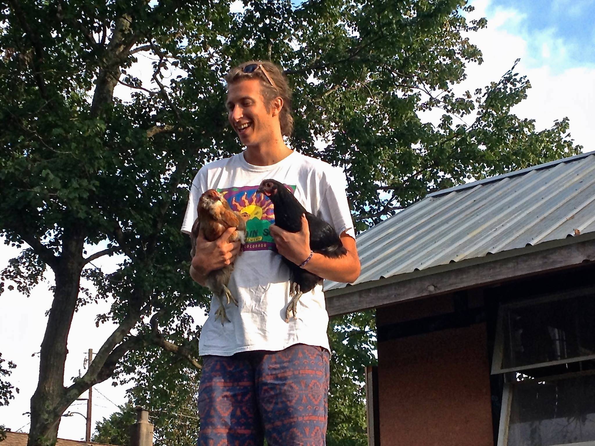 Rowdy Keelor holding some chickens.