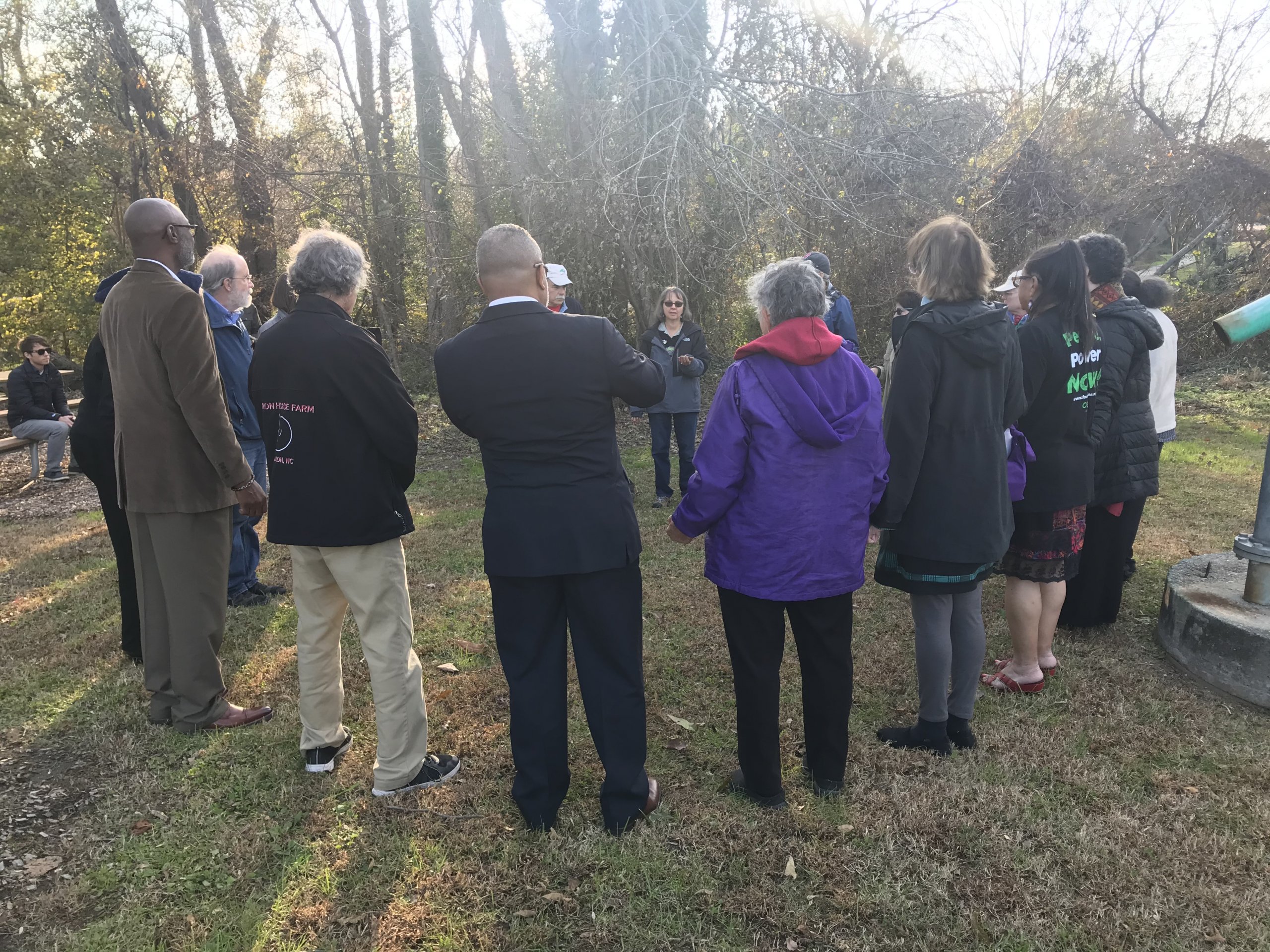 The group gathers in a circle for community reflections