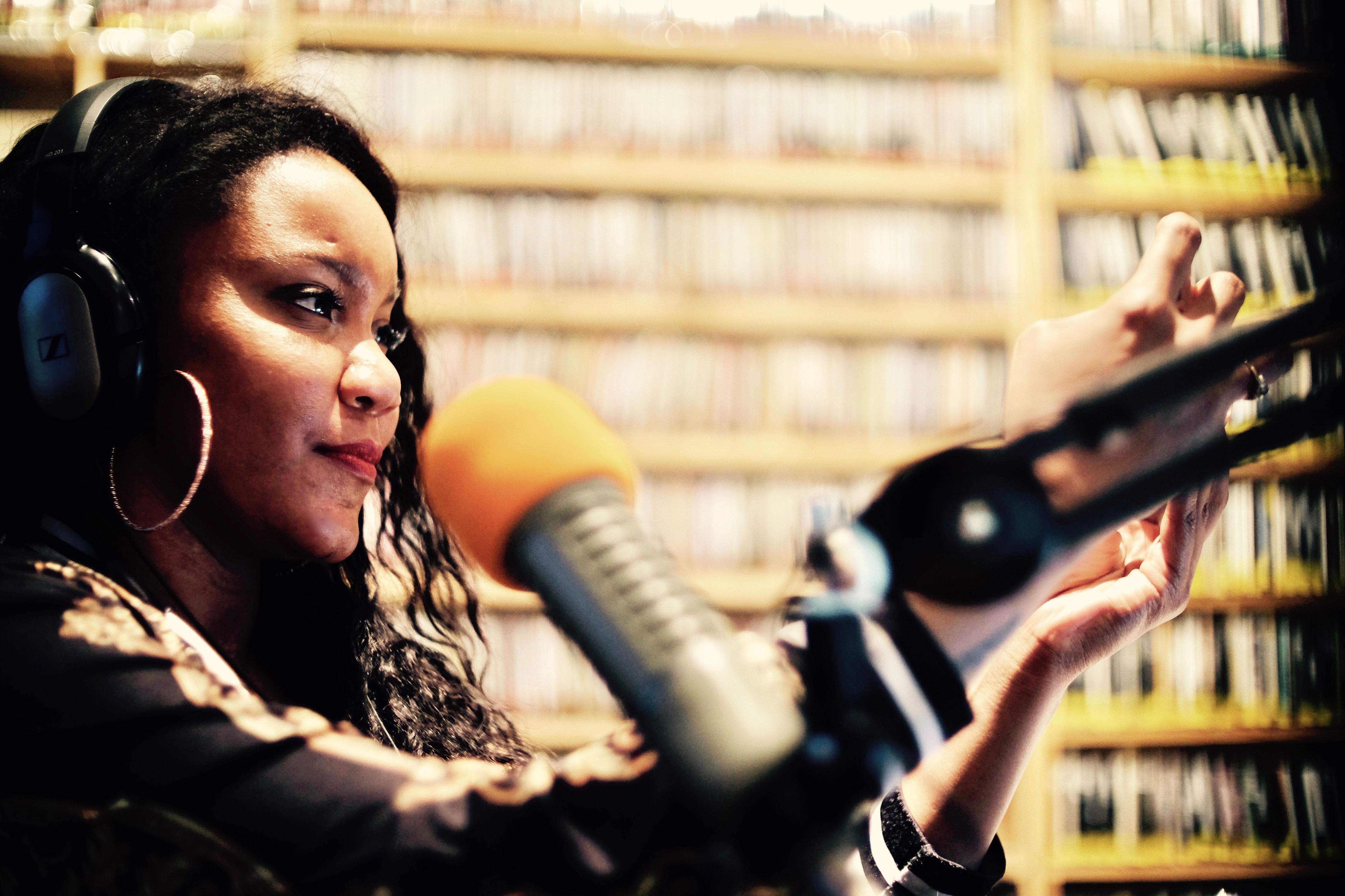 elizabeth-lashay-garland-woods-and-wilds-woman-with-microphone-and-headphones-radio-host