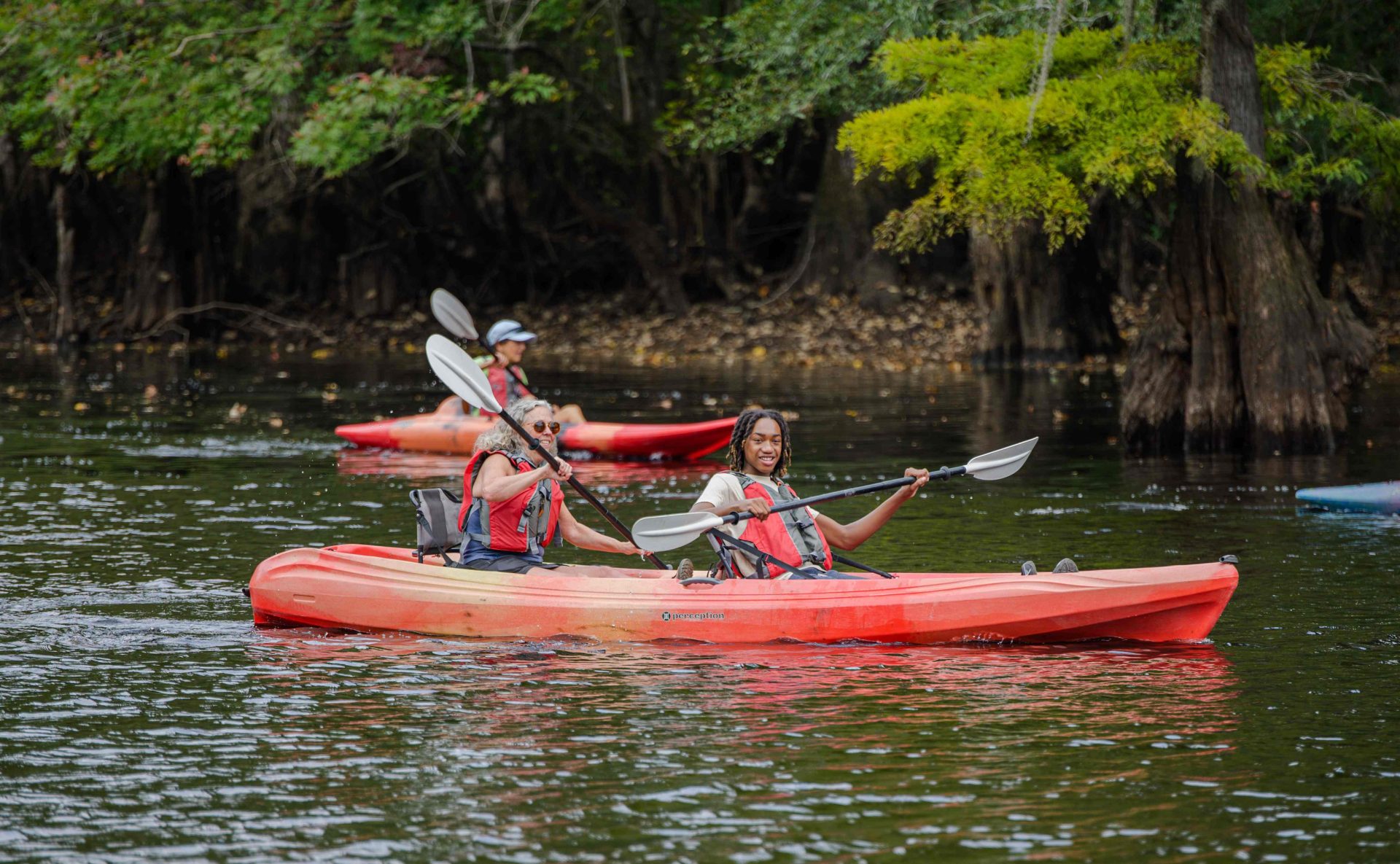 two-people-in-kayak-on-river-freedom-land-justice-conservation